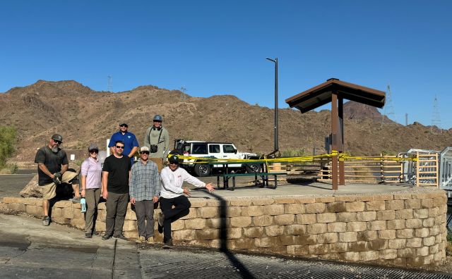 Crew stands with completed repairs.