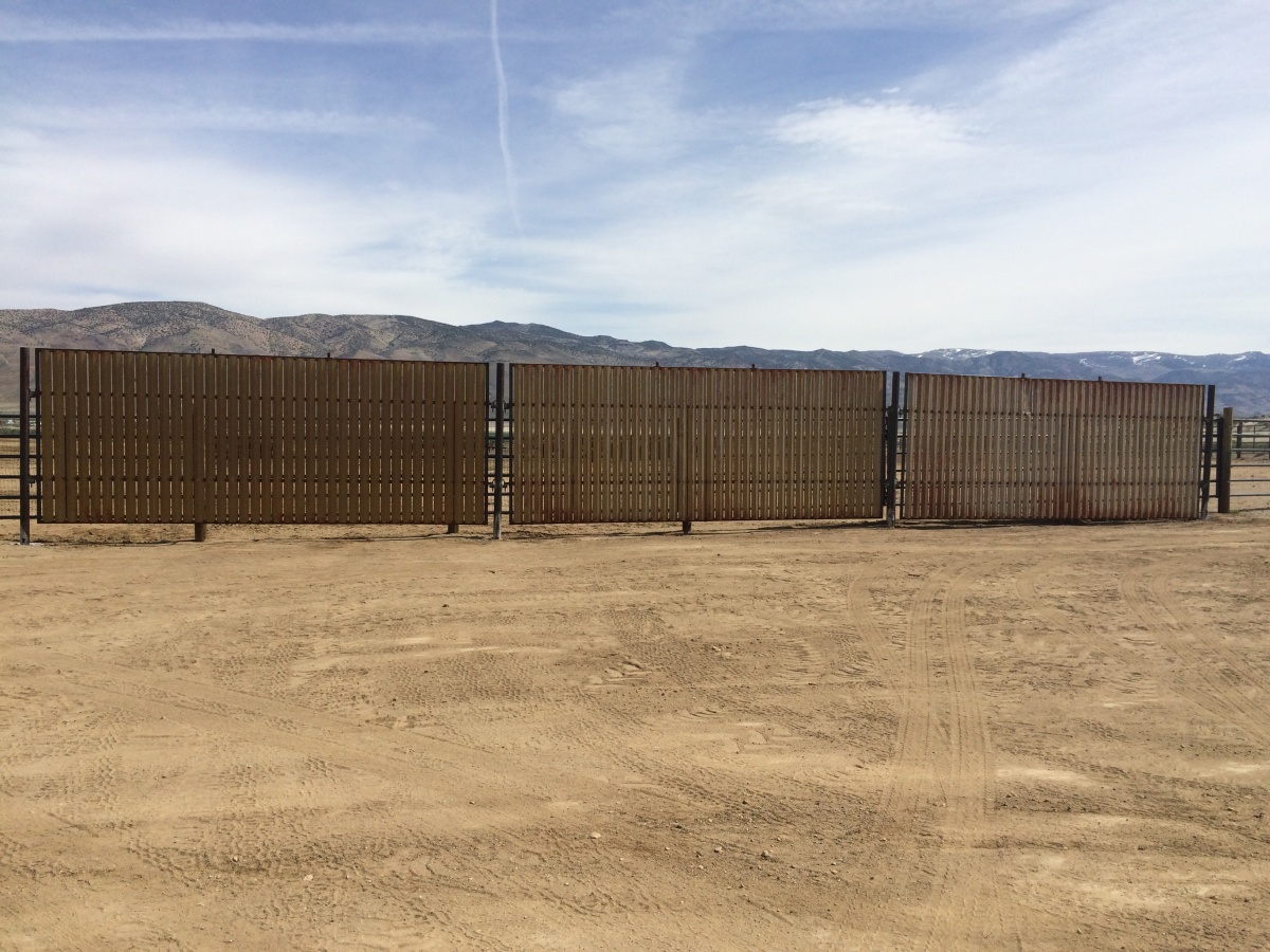Windbreaks along panels at off-range corral for wild horses and burros