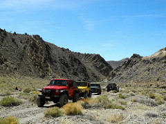 Jeeps on a dirt road in a mountain area. Photo courtesy of U.S. Forest Service.
