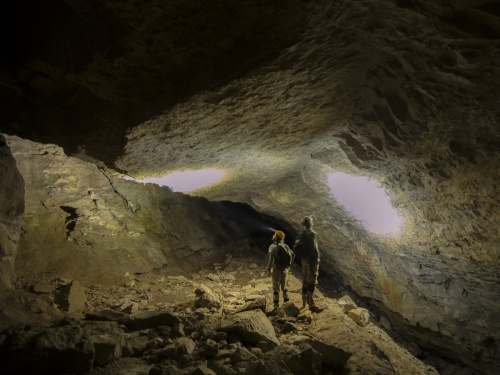Cavers hike through Bloomington Cave.