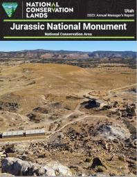 cover photo of Jurassic National monument depicting a topo black banner and cover photo of a barren brown landscape