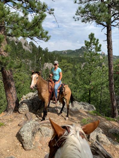 Laura Newberry trail rides with Buckeye Boone