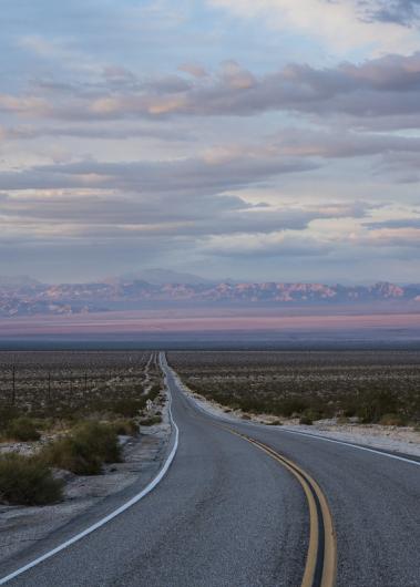 Purple sunset on a desert highway.