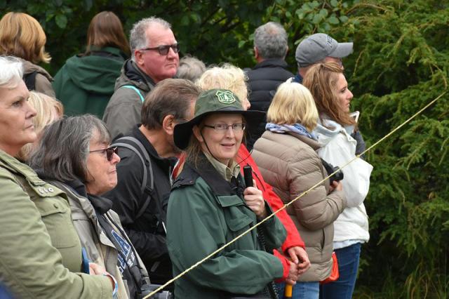 A US Forest Service ranger talks to visitors about the Mendenhall Glacier