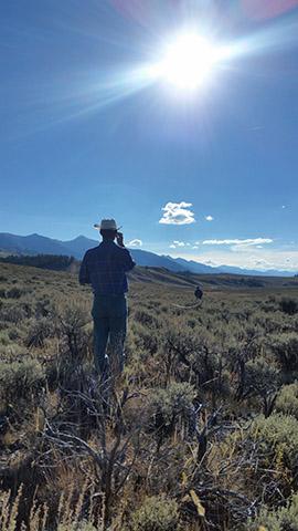 A pair of technicians lay out a transect to begin monitoring vegetation condition