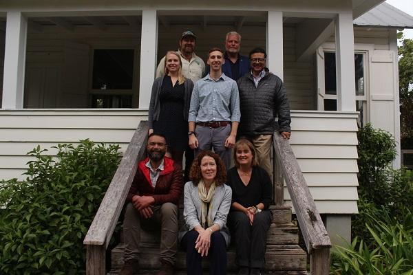 BLM Eastern States staff and the BLM Director sitting on the steps steps of the Tindall House 