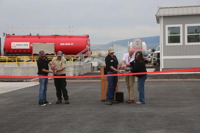 Representatives from the BLM, U.S. Forest Service, and the Casper-Natrona County International Airport cut the ribbon, officially opening the Casper Airtanker Base for operations. 