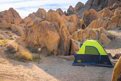 Tent against some tan rocks