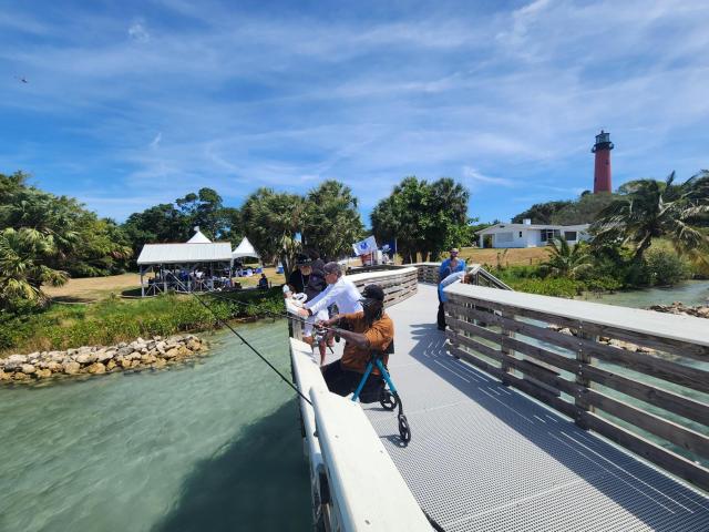 Veterans fish from the pier at the Jupiter Inlet Lighthouse Outstanding Natural Area