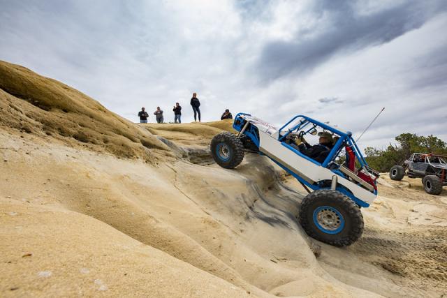 An off highway vehicle cresting a ridge at the rock crawling competition at Glade Run Recreation Area.