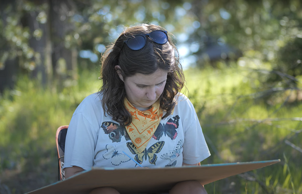 Serena Richelle, a gifted scientific illustrator, studying and sketching the Monument’s unique species