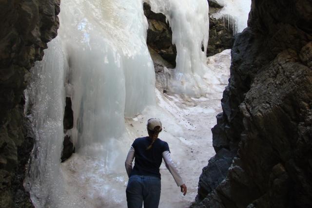 A hiker visits Zapata Falls after they have frozen solid.