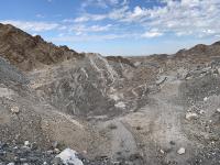 A rock pit with blue sky and clouds. 