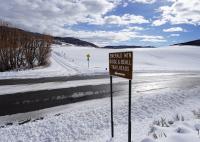 Photo of Emerald Mountain Road Sign and snow