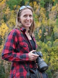 New manager for the BLM Grand Junction Field Office Stacey Colon holds camera. Colon enjoys photography as a hobby.
