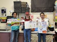 5th grade entrants posing with their winning posters
