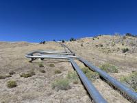 Photo 1: Geothermal pipelines running across BLM managed lands in Beaver County, UT. Photo by: JD Mallory
