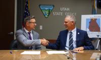 Jerry Davis, BLM Utah Acting State Director, and Scott Strong, Utah DNR State Parks Director, finalize the land conveyance documents.