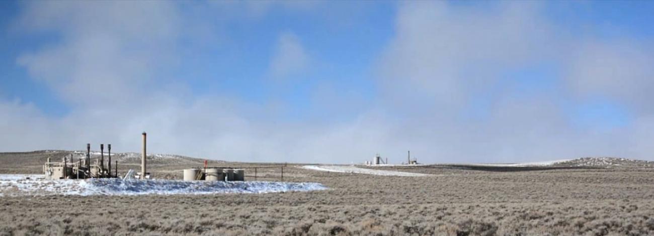 Oil pads on a wide and flat area of sagebrush in Wyoming