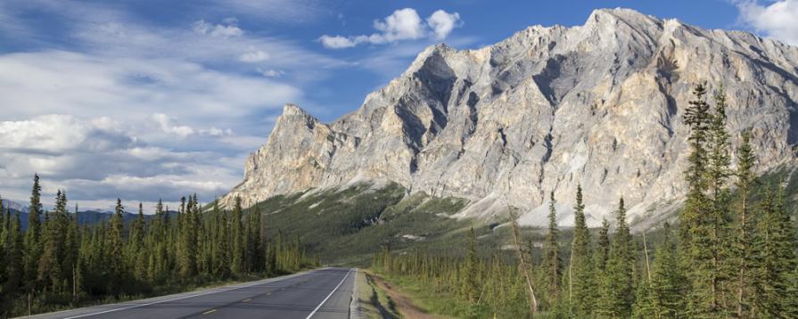 Dalton highway with Sukakpak Mountain looming ahead just to the right