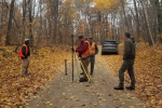 A BLM cadastral survey team works alongside a USDA Forest Service Surveyor in Chippewa National Forest in establishing the boundaries for the parcels identified for transfer to the Leech Lake Band of the Ojibwe. 