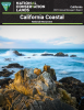 rugged coastal scene with rocky outcrops jutting out from the ocean. Waves crash against the rocks under a partly cloudy sky, with the blue ocean stretching into the horizon, creating a dramatic and serene seascape